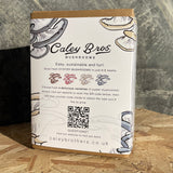 Caley Bros mushroom kit packaging with QR code on a wooden surface